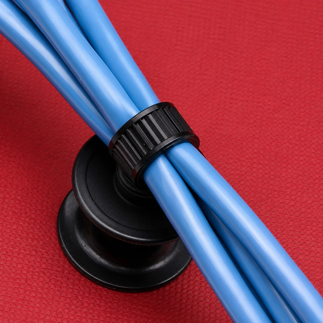 Automotive chassis cable ties fastening blue cable bundles