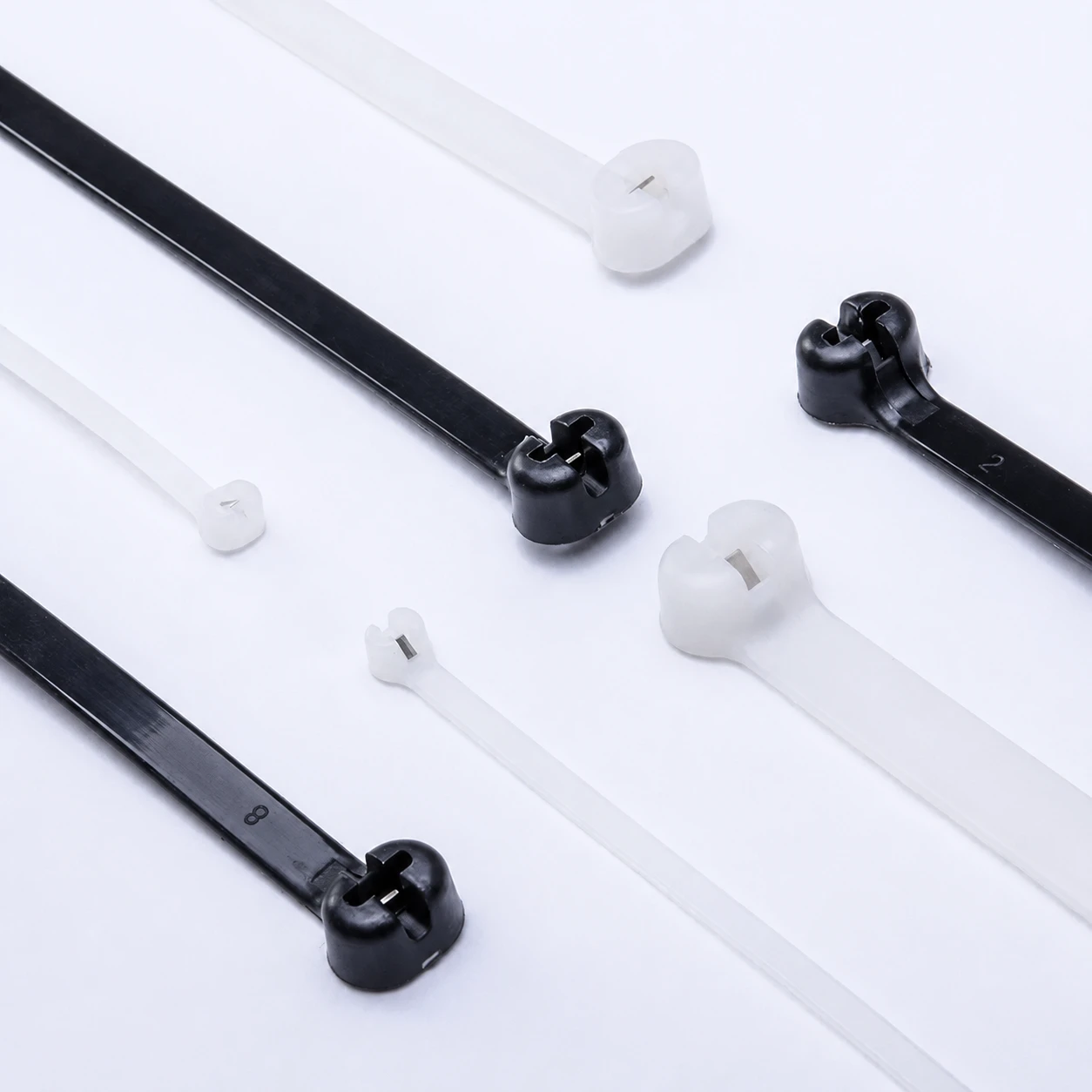 Black and natural nylon cable ties with stainless steel pawl locking heads