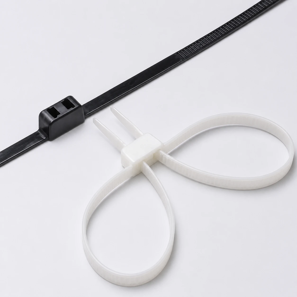 Double loop mounting cable ties in black and natural color