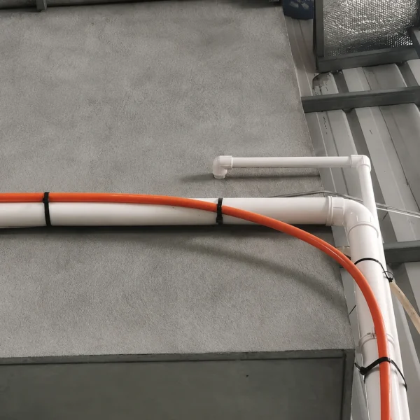 8.8mm extra heavy duty cable ties securing pipes and orange cable