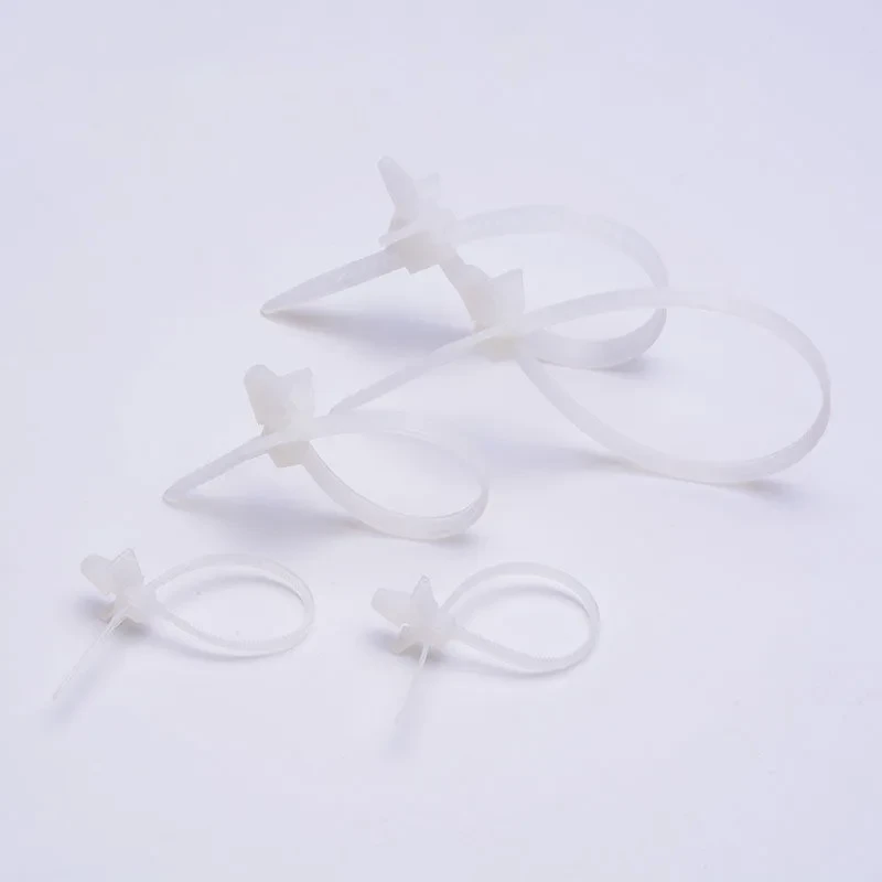 Natural push mount cable ties for pre-drilled hole installation and light cable bundling