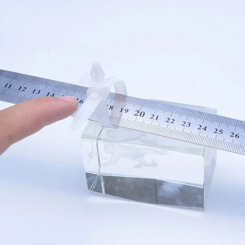 Push mount cable ties measured with a ruler for size confirmation
