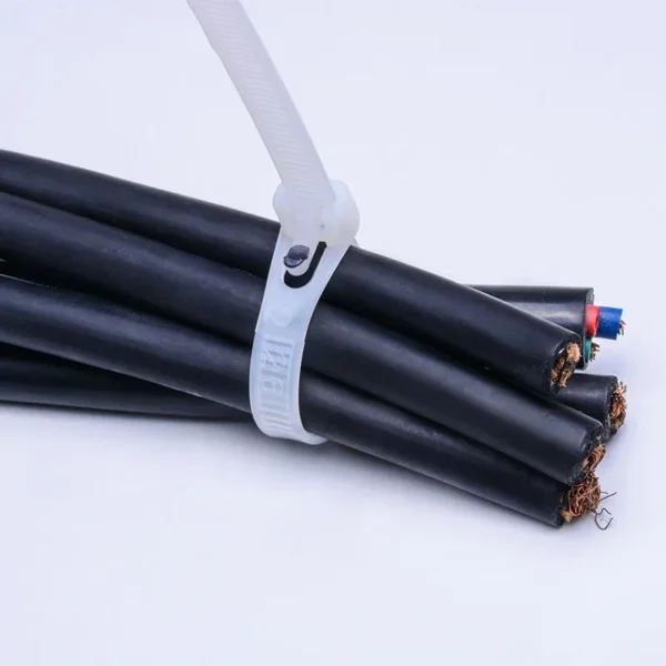White releasable cable tie securing electrical cables and wire bundles