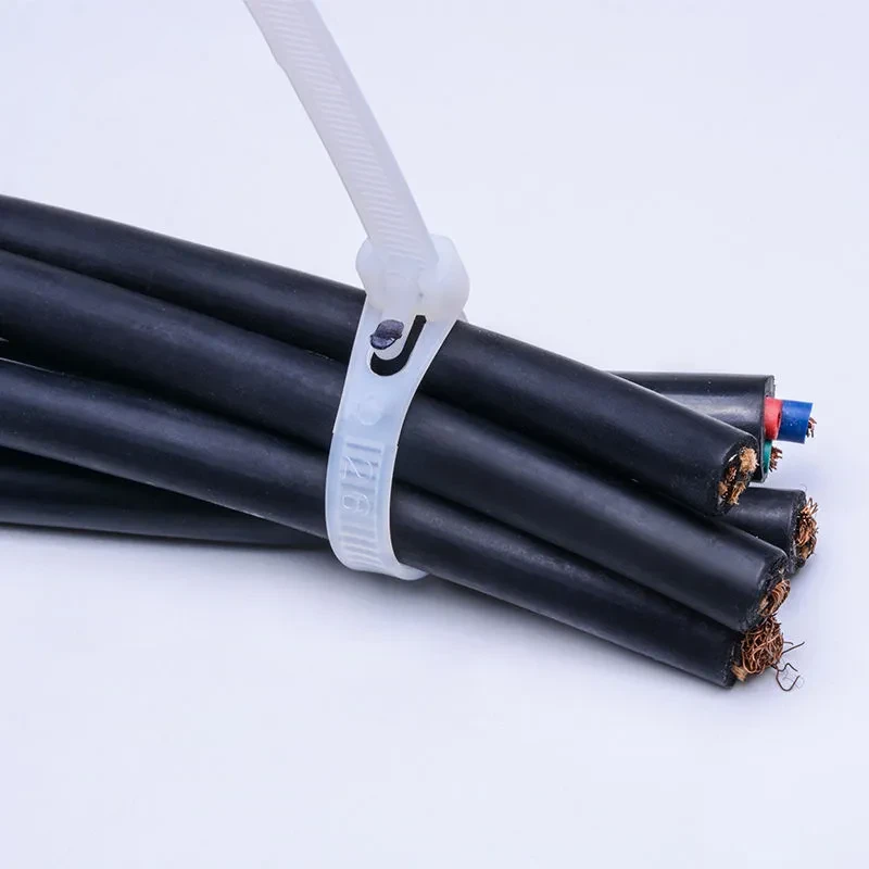 White releasable cable tie securing electrical cables and wire bundles