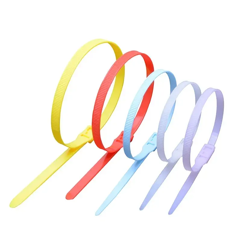 Five colorful slap bracelets in yellow, red, blue, light blue, and lavender set on a white background.